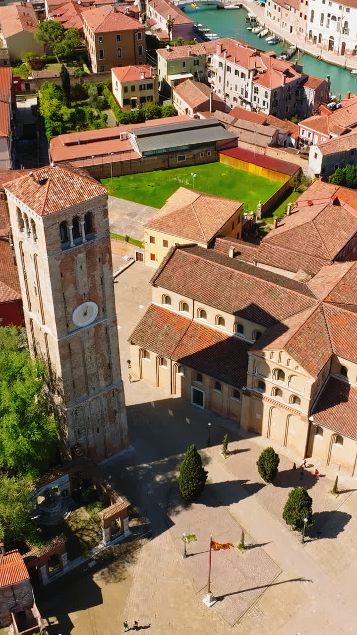 Aerial drone view of Church of Saints Mary and Donato, Murano, Italy. Vertical