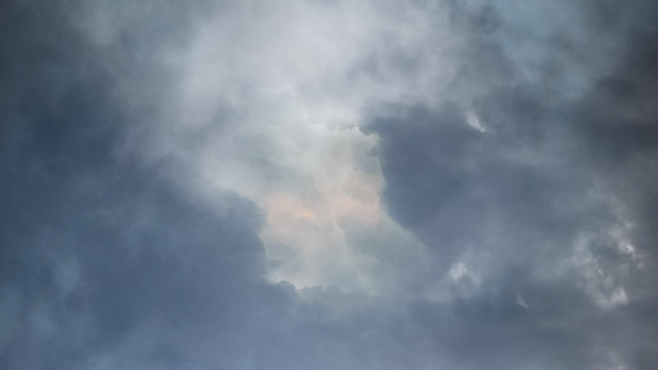 Massive thunderstorm moves  with dark  clouds