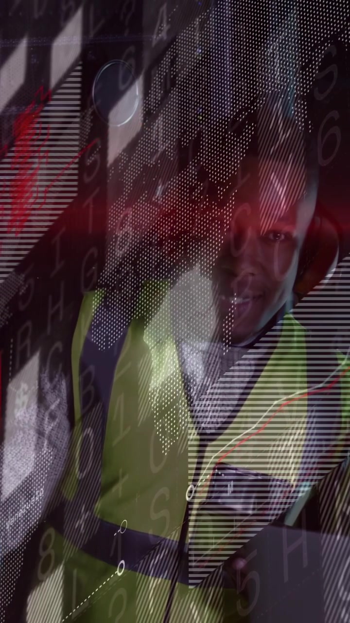 Vertical video: Driver in cabin hi vis turning gaze talking data overlay scrolling monitoring fleet