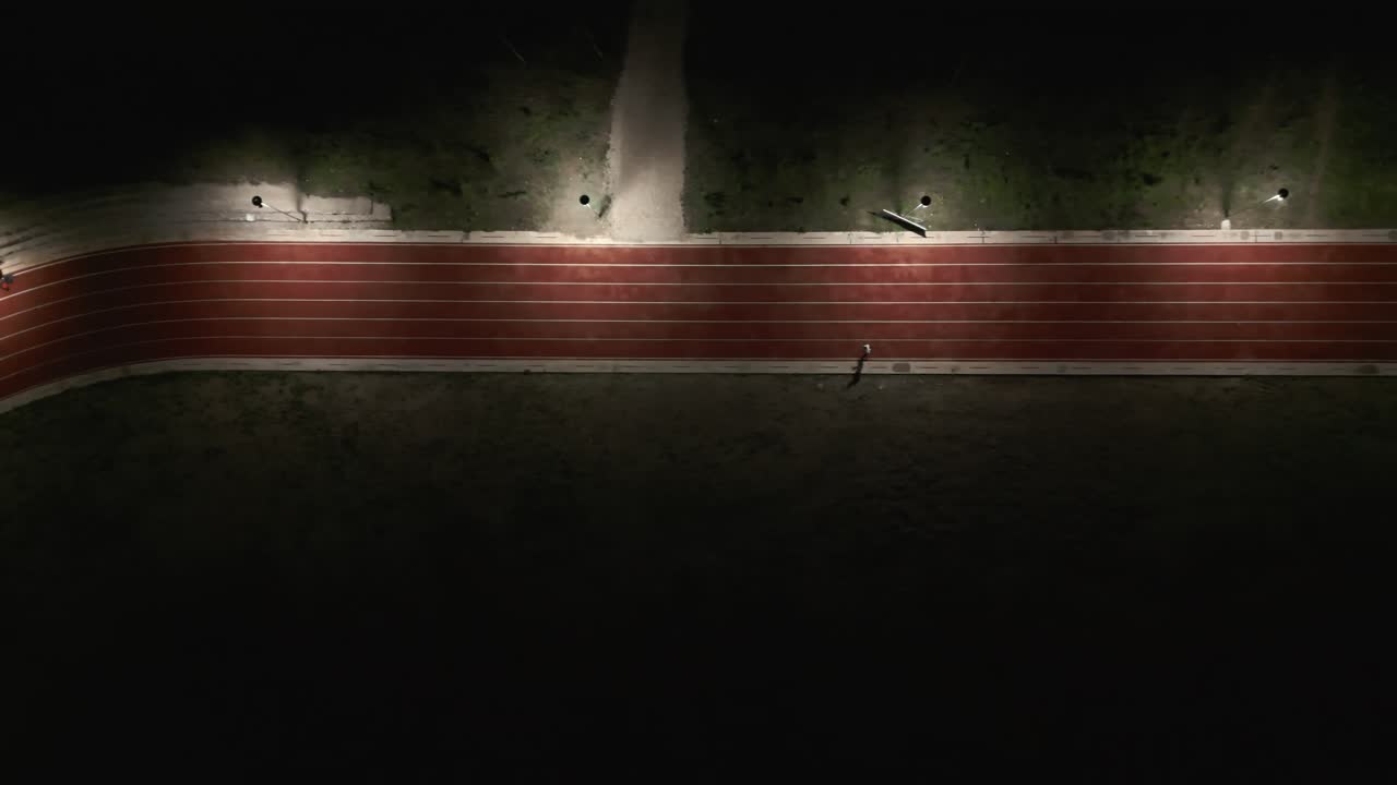 Top-down birds eye tracking shot of me running in the track.