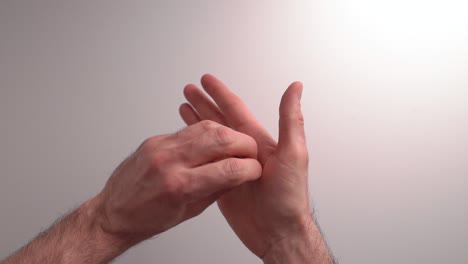 hand cleaning technique part2 with hand sanitising gel in slow motion.bright background male hand. plenty of space for text. great video for educational purposes