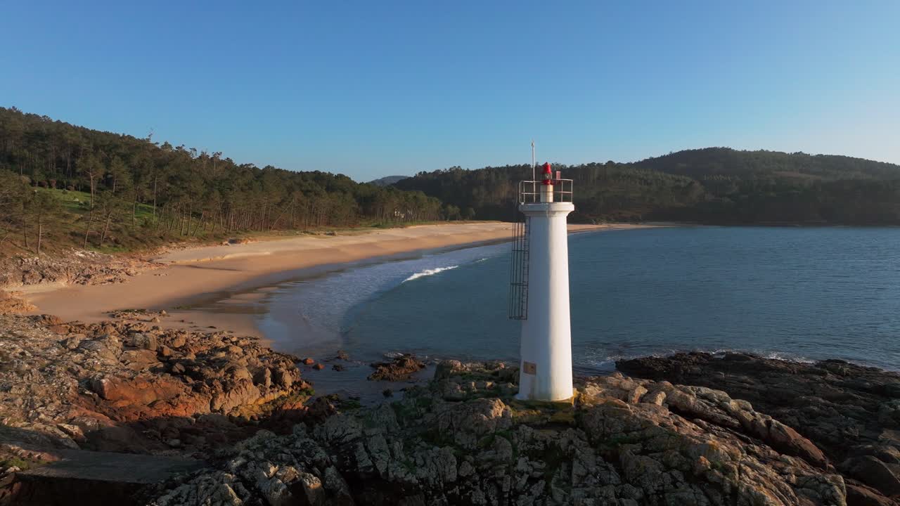 Waves Crashing On The Rocks With Fazo baliza do Lago In Daytime. - aerial shot