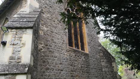 exterior of old holy trinity church in headington quarry, oxford, england