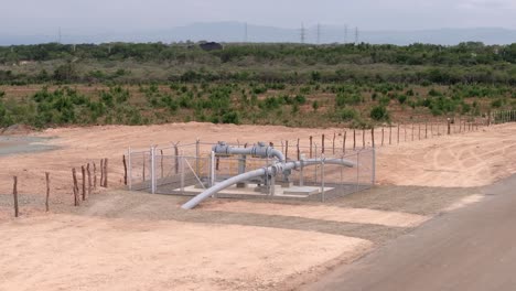 Aerial-view-around-a-fenced-natural-gas-pipe-in-remote-wilderness