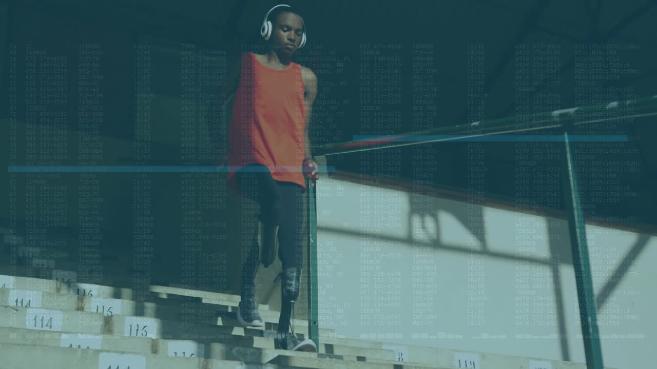 Wearing headphones, person walking down stadium steps with data overlay animation