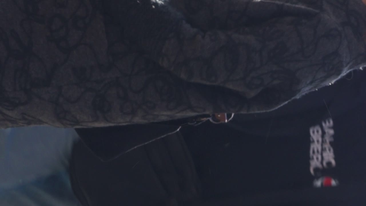 People enjoying a sunny day, sitting at an outdoor cafe table,in the background in Piazza Duomo sunday morning, Cremona Italy