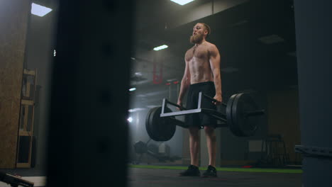 Athletic-Beautiful-man-Does-Deadlift-with-a-Barbell-in-the-Gym.-Gorgeous-male-Professional-Bodybuilder-Workout-Weight-Lift-Exercises-in-the-Authentic-Fit-Training-Facility.