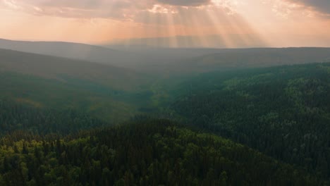 stunning aerial drone tilt up reveal of god’s fingers sunset over vast alaskan forest