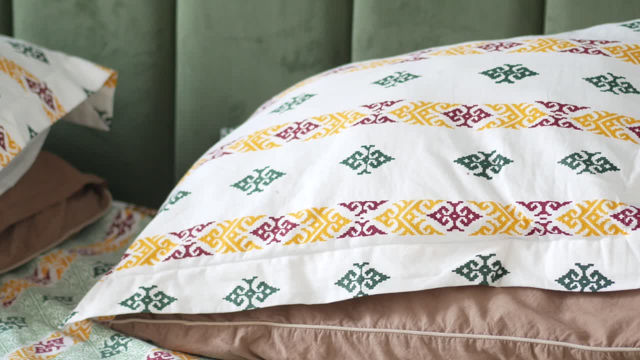 Printed Pillowcases on a Bed