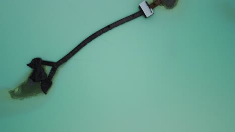 top down view over white crater kawah putih with pier platform over the sulfuric lake in bandung indonesia