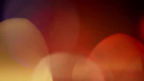 multicolored light leaks 4k footage on black background. stylizing video, transitions. bokeh effect
