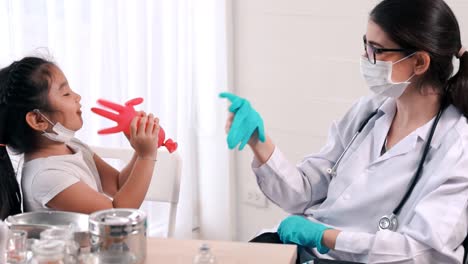 school girl visits skillful doctor at hospital for vaccination