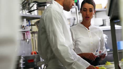 Chef-interacting-with-waitress