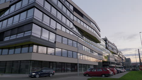 Golden-hour-sun-reflected-in-windows-of-a-new-office-park-building-on-December-morning