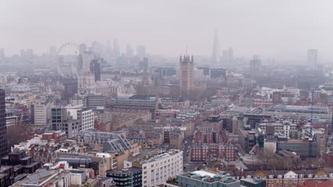 this shot depicts a panoramic view of london with a clear outlines of the most loved historical monuments surrounded by foggy mysterious atmosphere