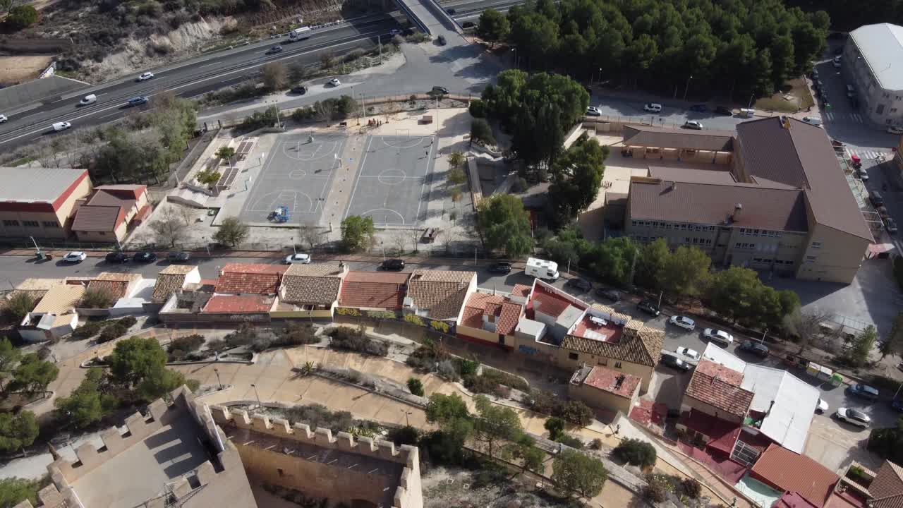 Aerial view of the Petrer castle, school and highway, Spain