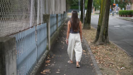 woman walking down a city street