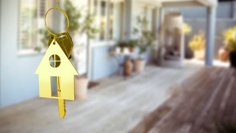 Hausschlüssel-Und-Schlüsselanhänger-Hängen-Unscharf-über-Der-Terrasse-4k