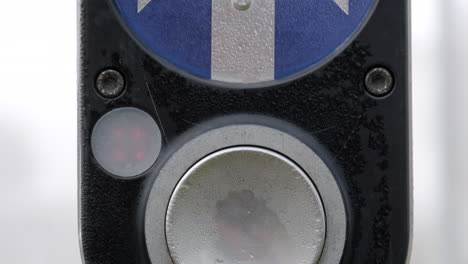 pedestrian crossing button at a traffic intersection