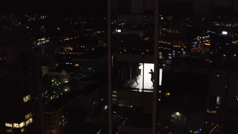 boxing training at night in city skyscraper