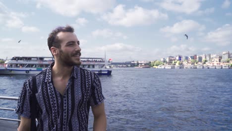 In-Istanbul-Eminonu,-the-young-man-watches-the-sea.