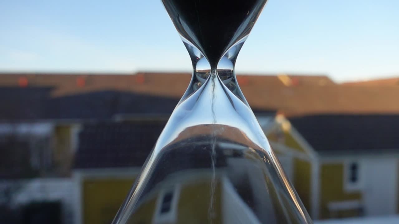 hour glass in front of the window