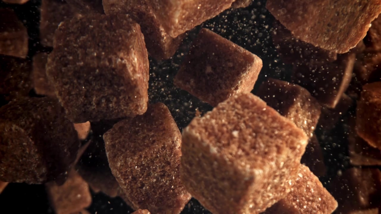 Brown Sugar Cubes Falling in Slow Motion