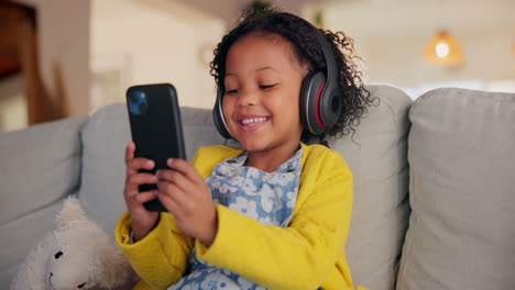 girl using smartphone with headphones