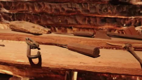 Medevil-shipbuilding-tools-exposed-on-wooden-table-middle-age-workshop-shipyard-shipwright-vessel-fifteenth-century-naval-construction-marine-engineering-maritime-explore-expedition-carpentary-15th