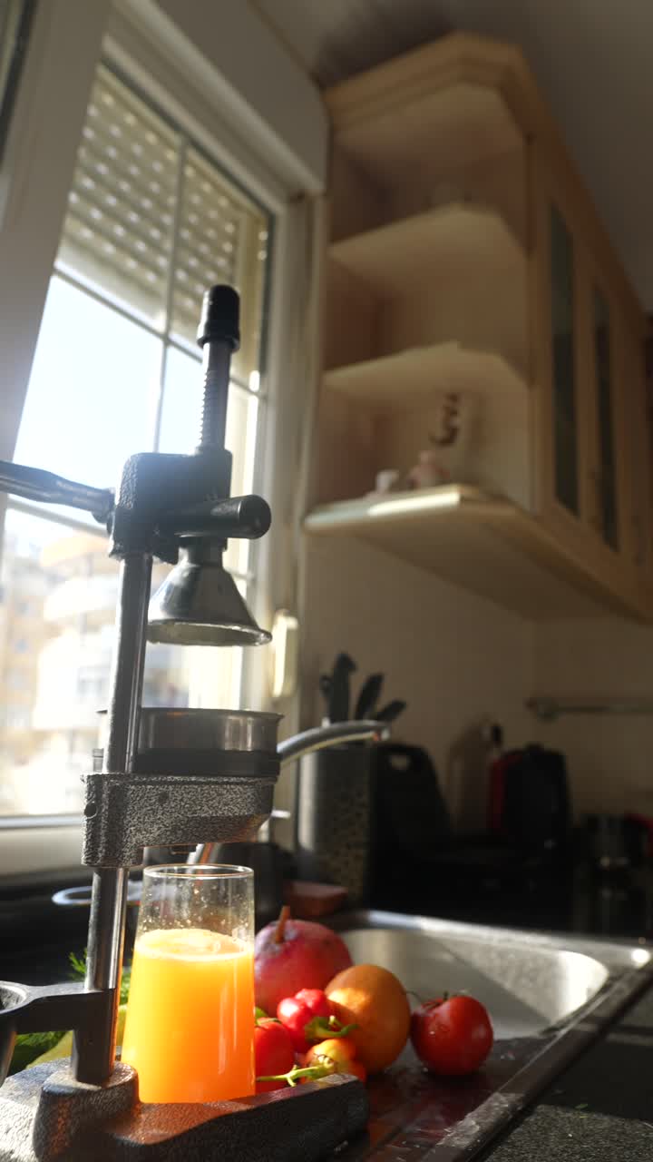 Making Fresh Orange Juice in a Kitchen