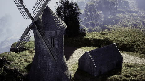 historical windmill stands majestically on rocky landscape during golden hour