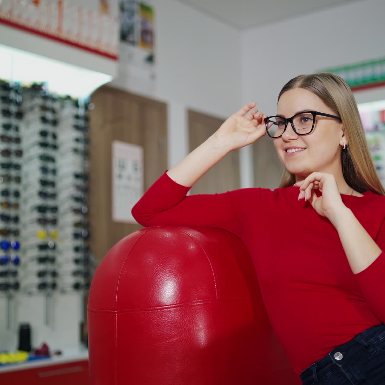 Young woman trying eyeglasses