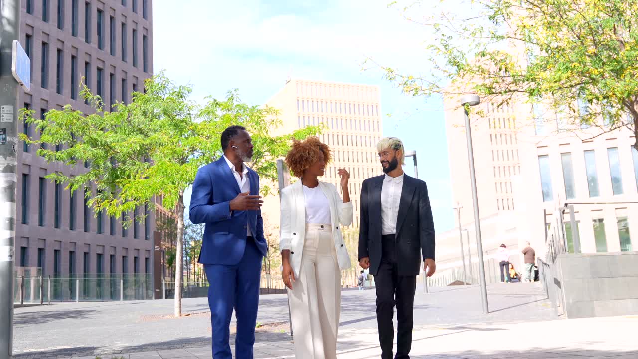 Business people walking and communicating on the street