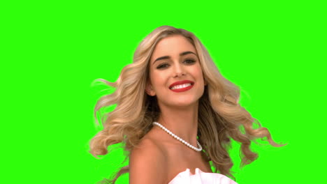 pretty woman tossing her hair on green screen