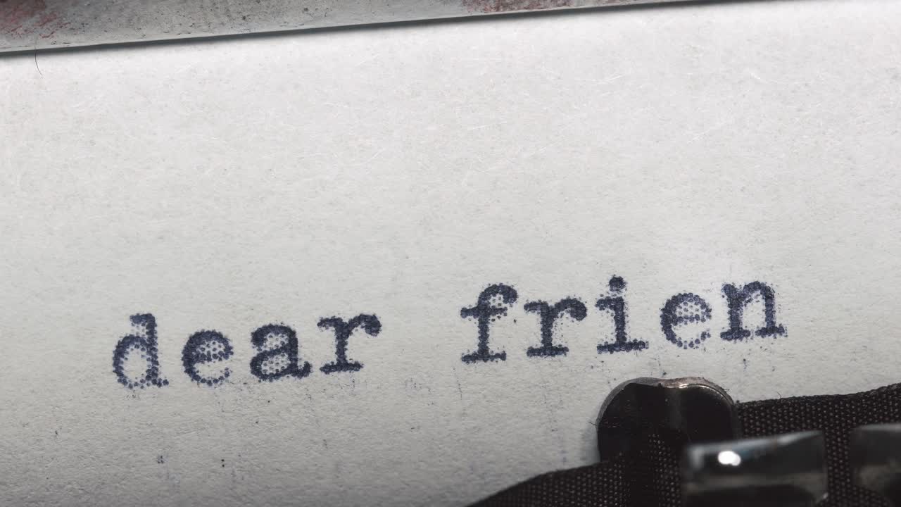 Typewriter with 'Dear' Message