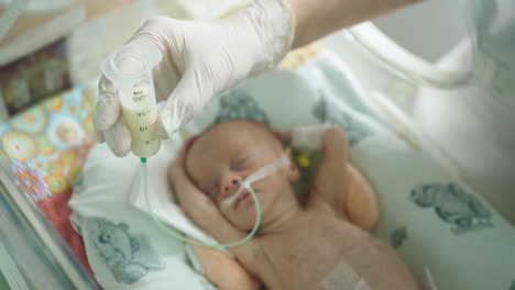 feeding a newborn in the nicu
