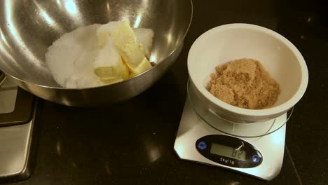 weighing brown sugar in a scale