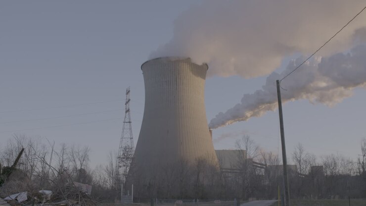smoke coming from smoke stack and factory
