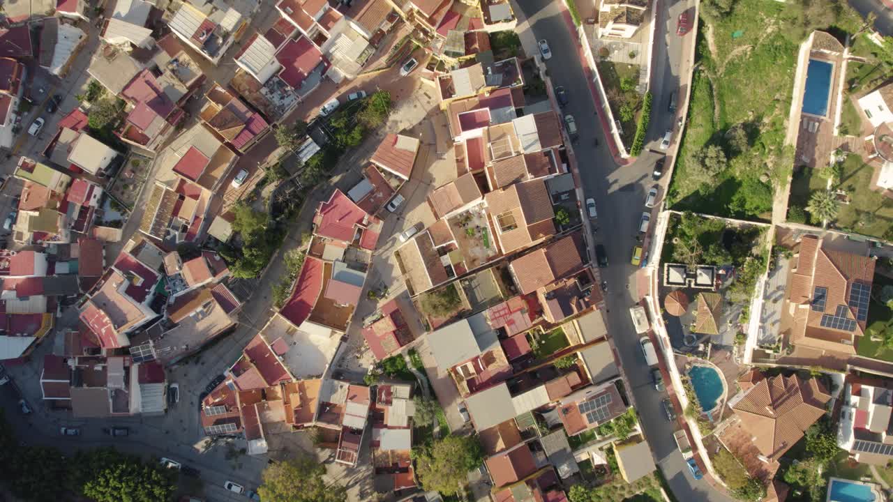 Aerial view of San Anton displaying city's colorful rooftops and natural beauty