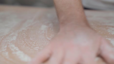 bread pre-preparation process by flouring the table