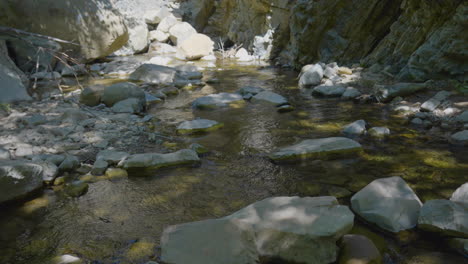 ascending shot of small creek to hill side of mountain located in santa paula punch bowls southern california