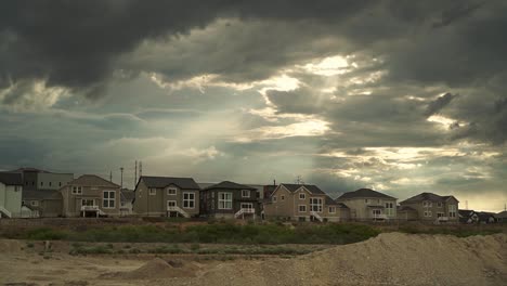 stormy sky over new suburban homes