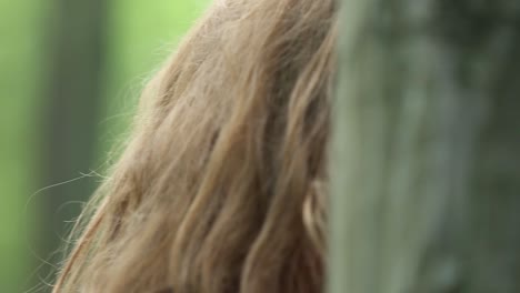 pretty woman walking in the forest. pretty woman in a long red dress walking in the forest