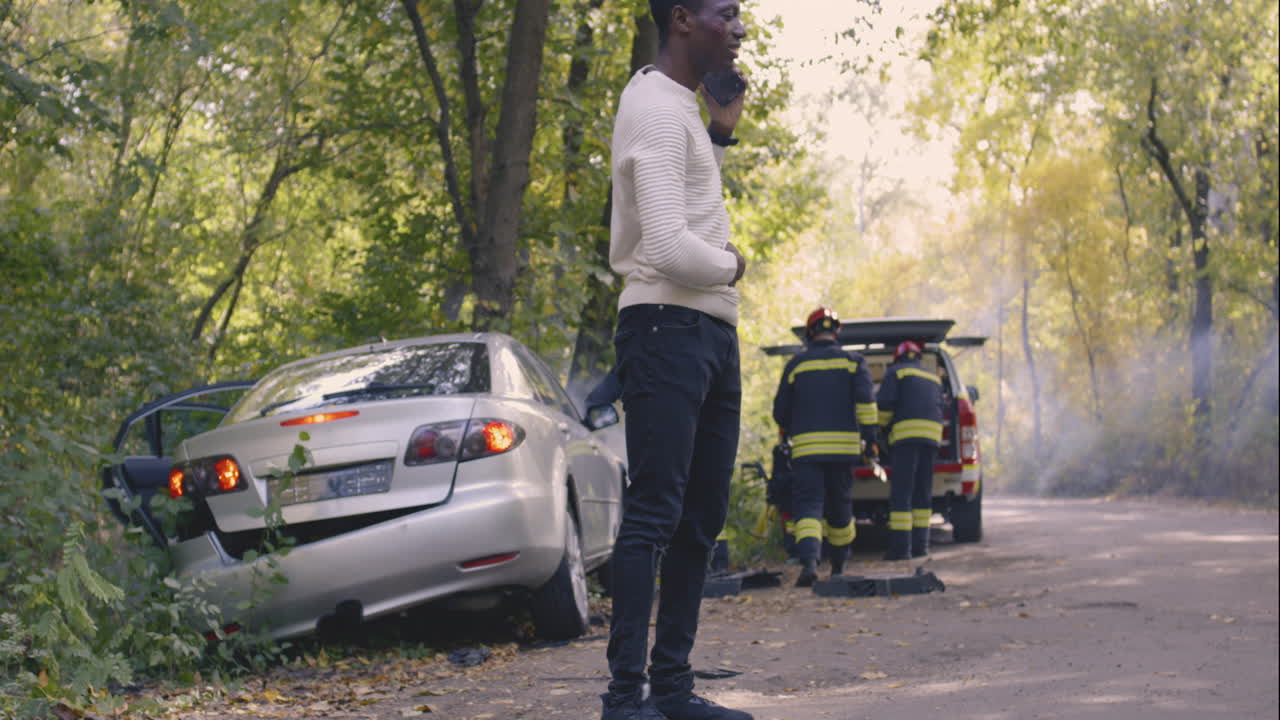 Accident Scene with First Responders and Injured Person