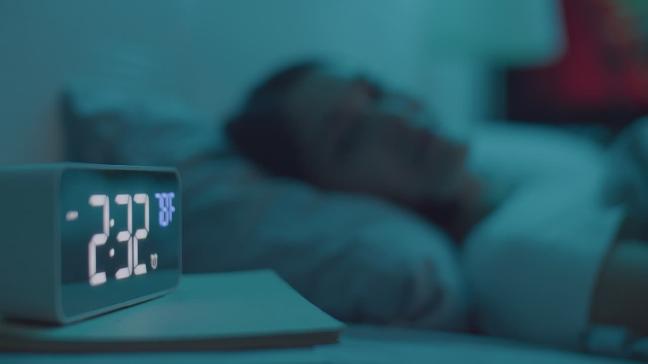 Woman Lying in Bed Suffering from Insomnia at Night