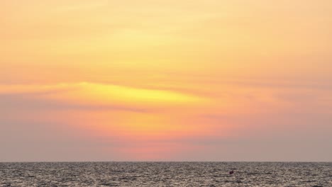 timelapse of a golden sunset overseas. round orange sundown into the water in the summer evening. landscape nature sunrise background. footage b roll of sun. yellow sunset sky. beautiful calm ocean.