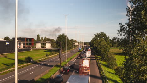 Car-accident-with-burning-black-smokes-and-traffic-jam-on-highway-road,-time-lapse-view