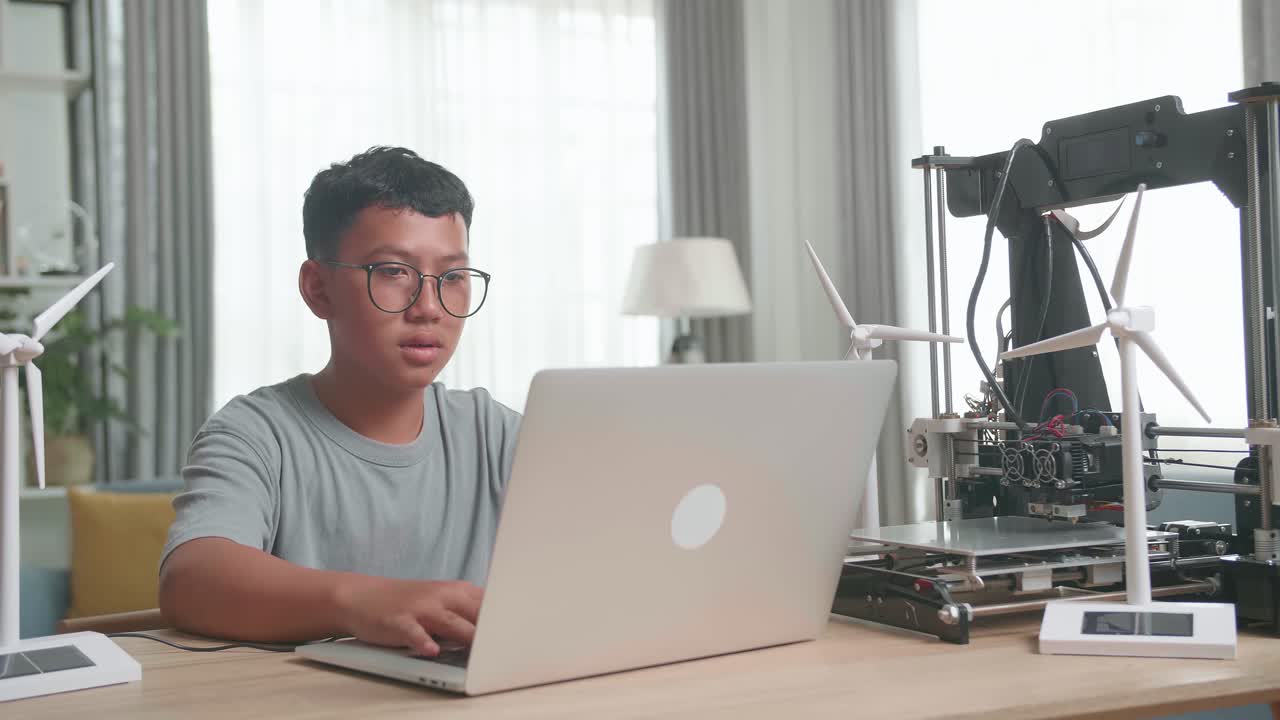 Boy learning about renewable energy and 3D printing