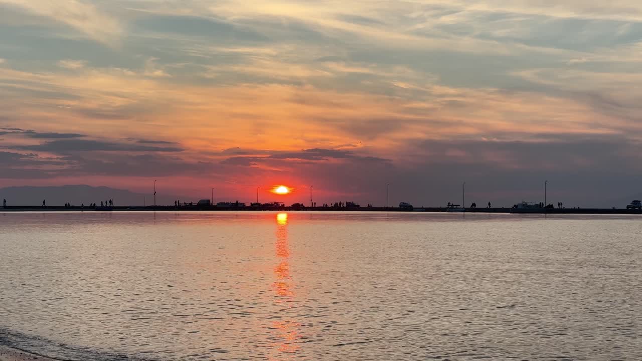Sunset gold hour beautiful sun set big orange skyline ocean sea reflection