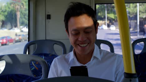 Male-commuter-using-mobile-phone-while-travelling-in-bus-4k